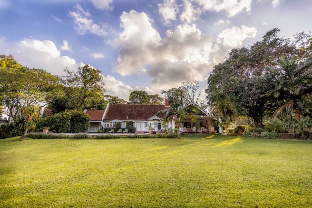 The front of the house set among the gardens