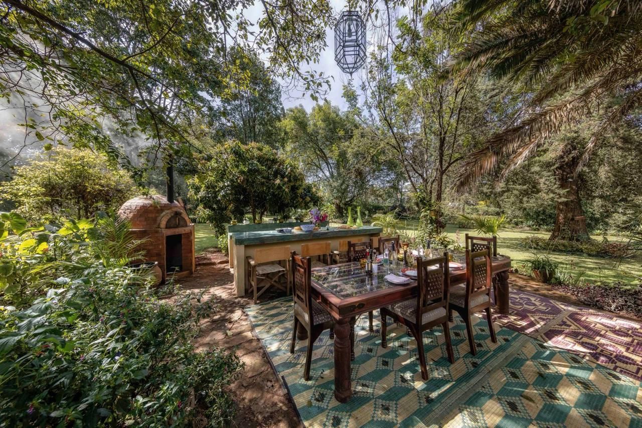 The wood-fired oven and dining table in the garden